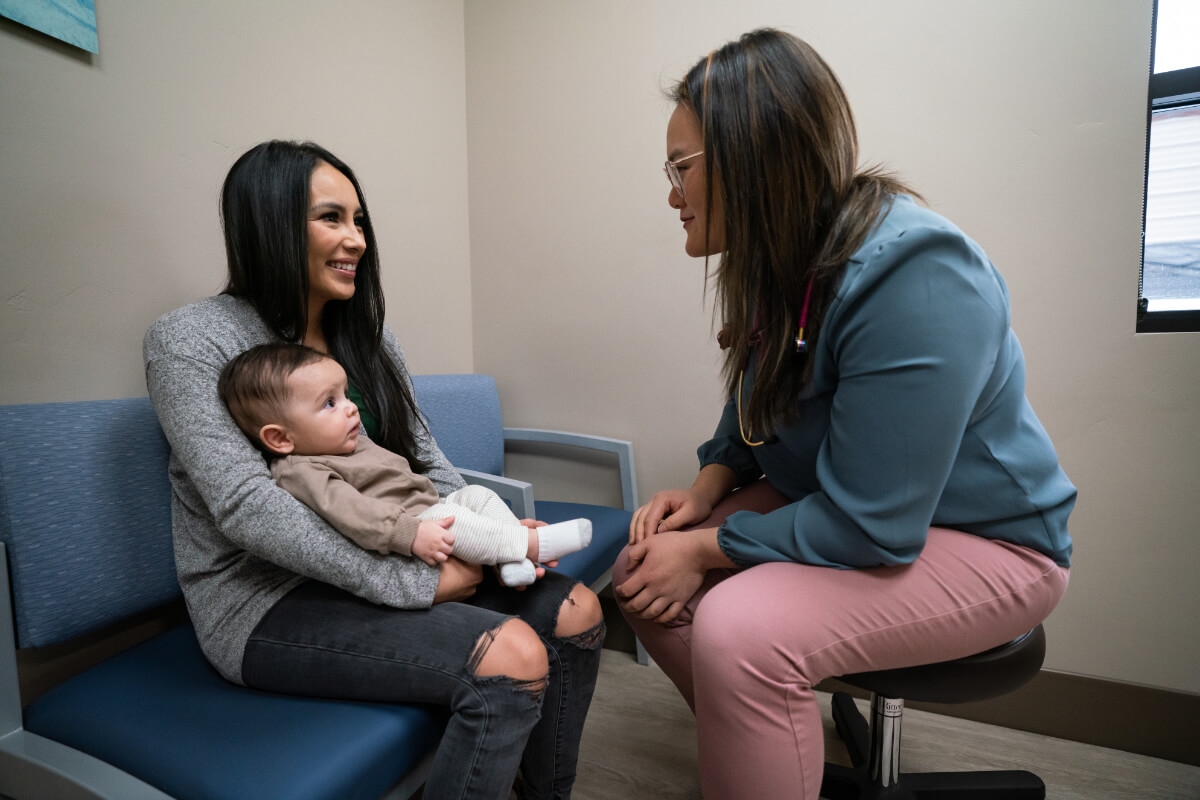Sarah Tang, MD with a mom and baby at Canyon View Medical Pediatrics